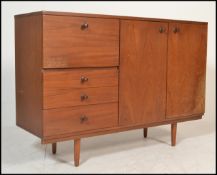 A mid century teak wood Avalon sideboard. Raised o