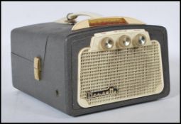 A vintage 20th Century Dansette TRG 45 portable battery operated MW-LW radio receiver 7