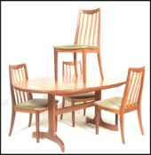 A 1960's mid 20th Century G Plan Fresco teak wood extendable dining table having an oval top with