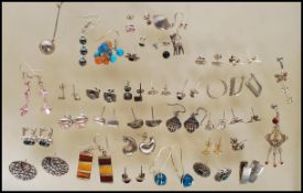 A selection of silver earrings including stud and drop earrings to include a pair of celtic knot