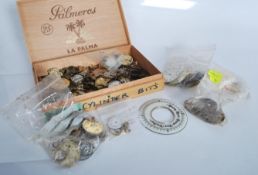 A collection of vintage 20th Century pocket watch parts, movements, faces and spares to include