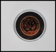 A 2009 Queen Elizabeth full 22ct gold sovereign coin, Queen Elizabeth to front with George slaying