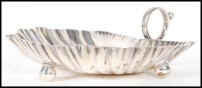 A 20th Century Mappin and Webb silver hallmarked trinket dish in the form of a leaf with shaped