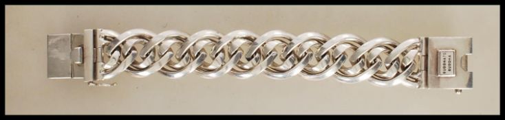 A stamped 925 silver designer Buddha to Buddha bracelet having a interwoven link design with a