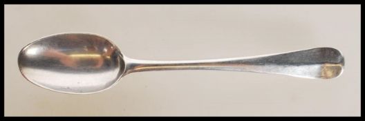 A Georgian 18th Century George I silver teaspoon having a rat-tail bowl with engraved crest to the