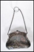 A early 20th Century silver hallmarked ladies coin purse having ball clasp atop with foliate