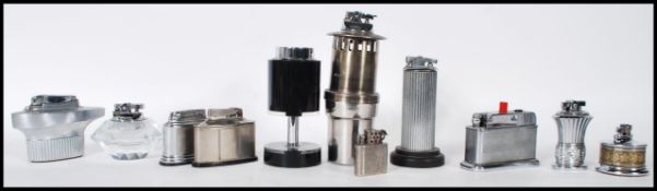 A collection of early to mid 20th Century Art Deco cigarette / cigar table desk lighters to