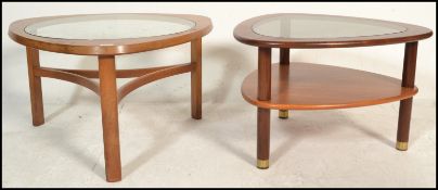 A retro 20th Century teak wood coffee table in the style of Nathan Trinity, having a circular