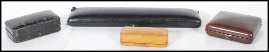 A collection of vintage mid 20th Century designer jewellery boxes to include a black Kutchinsky