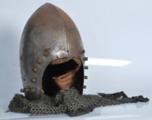 A believed 19th Century replica Medieval knights helmet with chain mail, authentic construction