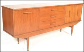 A mid 20th Century 1960's teak wood Danish style sideboard having twin cupboard doors to the right