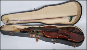 A early 20th Century cased violin musical instrume