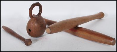 A carved wooden oriental Korean Buddhist Mokugyo Muyu percussion instrument of hollow bulbous form