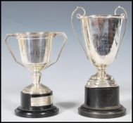 A pair of silver hallmarked trophies, one marked for Clifton Club Squash Rackets originally