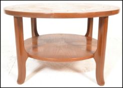 A mid century Danish influence teak wood circular astro coffee table in the manner of G-Plan