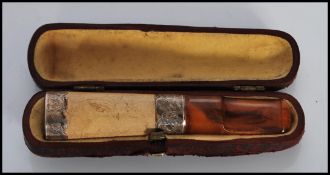 A early 20th Century silver and wooden cheroot hol