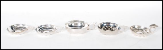 A group of 20th Century French silver plated 'Tastevin' wine tasting cups each having engraved