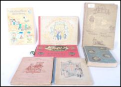A selection of books dating from the 19th Century onwards to include 'The Whispering Winds and the