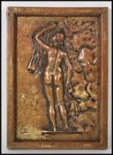 A 20th Century cast bronze wall plaque having an embossed design depicting a classical figure of