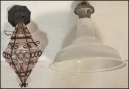 Two mid 20th Century vintage retro pendant ceiling lights to include a shaped amethyst murano