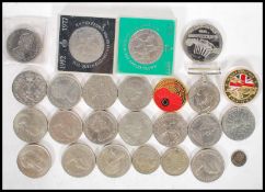 A collection of coinage to include a quantity crowns, World War two medal, two commemorative war
