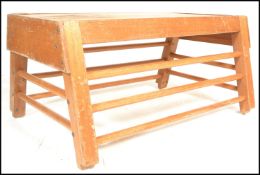 A vintage mid 20th Century lower section of a school gymnasium vaulting horse / pommel horse,