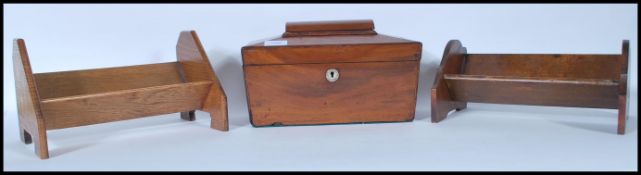 A 19th Century Georgian mahogany tea caddy of sarcophagus form having a mother of pearl escutcheon