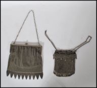 A pair of early 20th Century Edwardian ladies evening purses of silver plated / white metal mesh