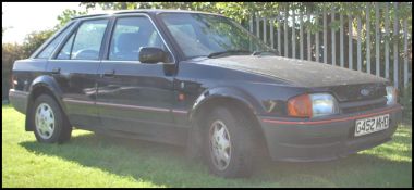 A 1990 ' G' Registration Ford Escort 1597cc ( 1.6) Ghia 5dr in black with 22000 miles on the clock (