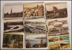 A large collection of postcards dating from the 20th Century, many postcards of coastal seaside