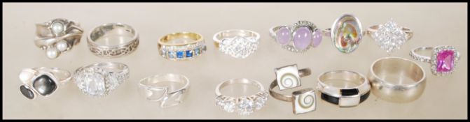 A collection of stamped 925 silver rings to include an mother of pearl ring, a celtic knot ring, a