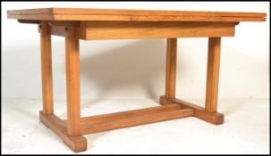 A mid 20th century solid oak Arts & Crafts revival large Air Ministry oak refectory draw leaf dining
