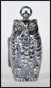 A silver plated sovereign / coin case in the form of an owl, having a hinge opening with