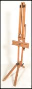 A large 20th Century Winsor & Newton Ltd, London, wooden artists folding easel frame on tripod feet.