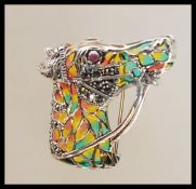 A stamped 925 silver brooch pendant in the form of a horses head having plique a jour and