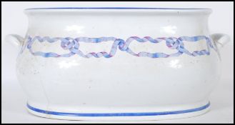 A 19th Century Victorian Minton's ceramic foot bath raised on a footed base with twin handles