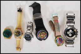 A collection of 20th Century wrist watches, predominately swatch watches together with gents dress