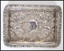 A George Lingard silver hallmarked dressing table tray of rectangular form having scrolled