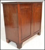 A 19th century Georgian mahogany cupboard / bookcase cabinet. Raised on bracket feet with twin