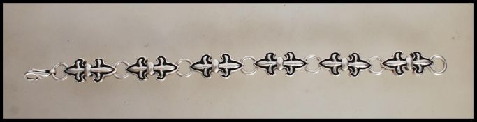 A designer Crazy Pig heavy double Fleur de Lys silver bracelet with lobster claw clasp. Signed Crazy