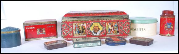 A collection of 20th Century vintage advertising tea and tobacco tins to include Lyons tea, Jacksons