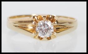 A hallmarked 9ct yellow gold oval single stone solitaire diamond ring having a central claw set