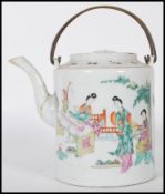A 19th Century Chinese ceramic teapot of cylindrical form being hand painted with a domestic scene