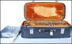 A good quality vintage 20th Century cased Boosey & Hawkes York International brass Trumpet, with
