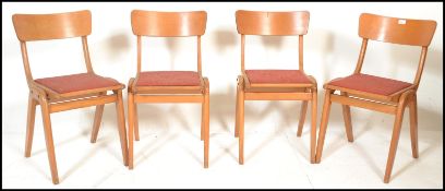 A set of 4 mid century stacking dining chairs in the manner of Ben Chairs. Beechwood bentwood a-