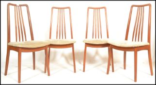 A set of four vintage retro mid 20th Century Danish dining chairs having teak wood frames raised