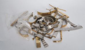 A collection of vintage watch strap bracelets, mostly expanding examples, rolled gold, stainless