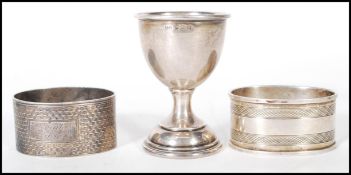 An early 20th Century silver hallmarked egg cup of simple form, hallmarks for Birmingham date letter