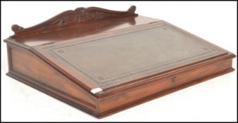 A Victorian 19th Century mahogany bankers clerks desk writing slope with tooled leather writing