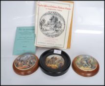 A group of three Staffordshire Prattware pot lids to include 'The Village Wedding', 'The Wolf and